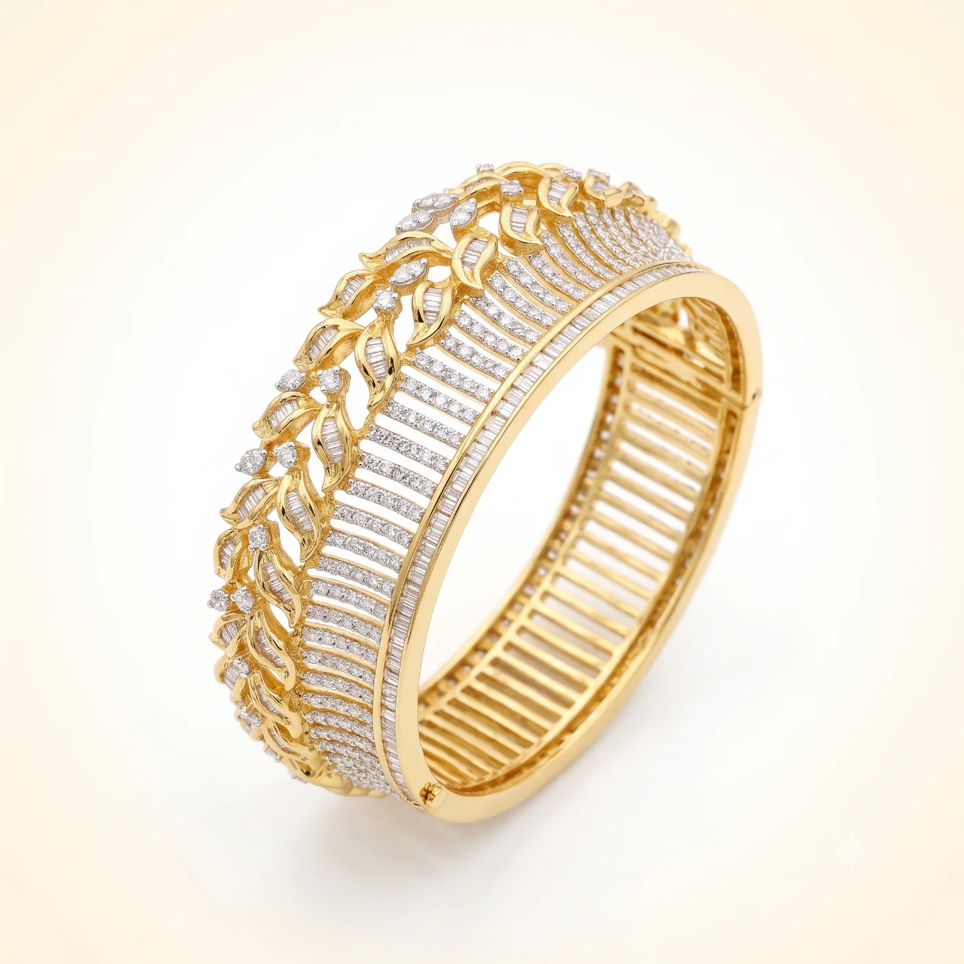 A filigree gold and diamond cuff from our Mumbai workshop, on a light studio ground